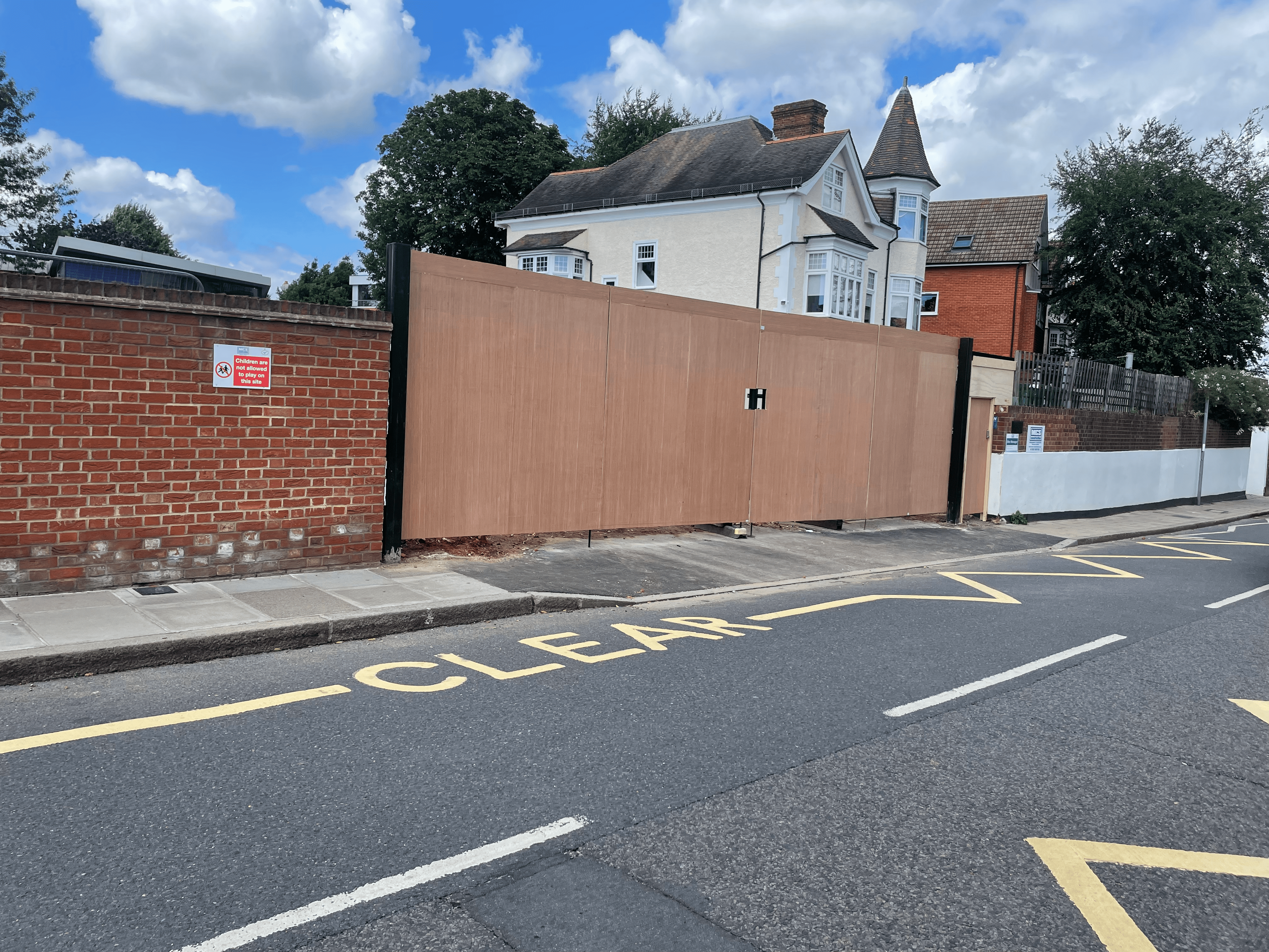 Bespoke bi-fold construction site gates